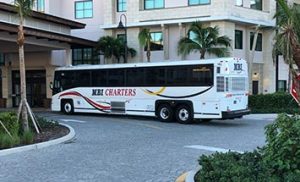 Wedding Party Bus Charter in front of hotel - MBI Charters
